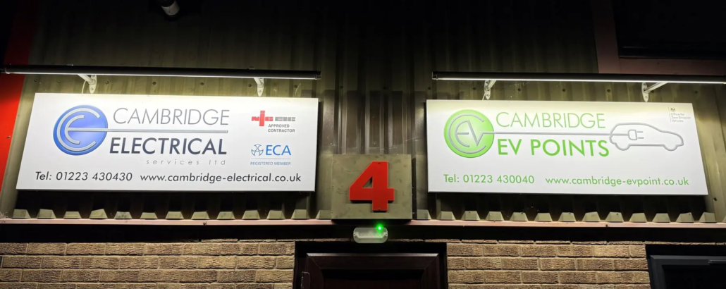 Cambridge Electrical and Cambridge EV Points signs above the door of our unit in Burwell